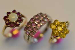 A heavy bundle of three 9ct gem set rings. Approx 8.8 grams. Est. £120 - £140.