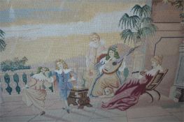 A large rectangular tapestry of a dancing scene in oak frame. 70cms x 90cms. Est. £50 - £60.