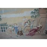 A large rectangular tapestry of a dancing scene in oak frame. 70cms x 90cms. Est. £50 - £60.