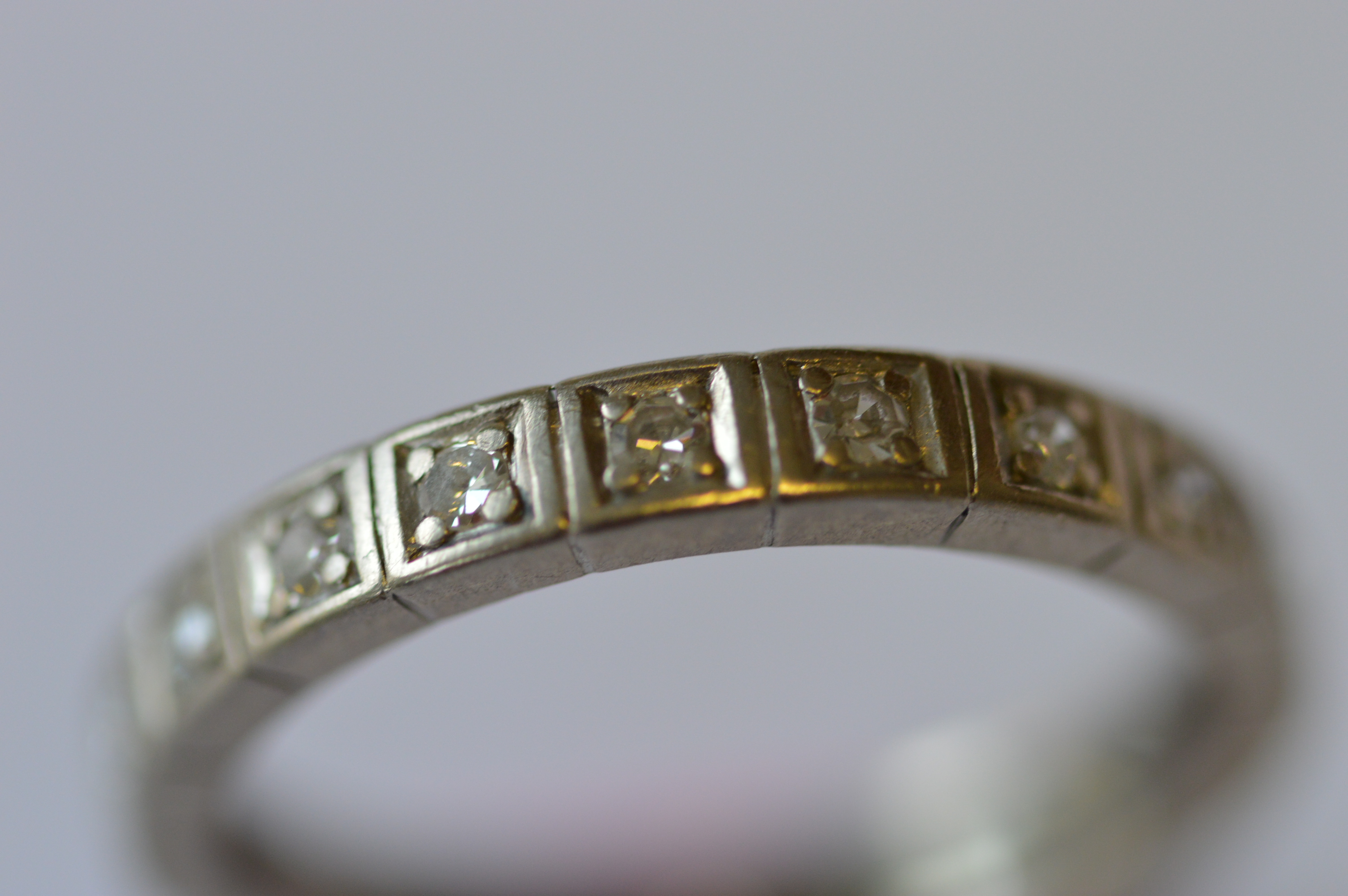 A white gold French diamond full eternity ring. Est. £260 - £280.