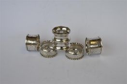 A pair of bright cut crimped edged napkin rings together with four others. Approx. 40 grams. Est. £