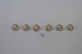 A set of 6 buttons decorated with seated ladies on scroll decoration. Birmingham 1901. By Levi and