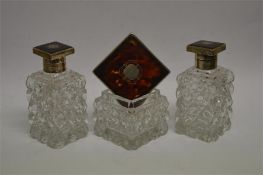 A good pair of hobnail cut tortoiseshell scent bottles with hinged covers, together with matching