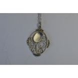 A silver Arts and Crafts pendant on fine link chain with loop top. Est. £60 - £70.
