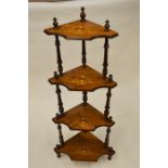 A four tier Edwardian inlaid what-not with turned supports. Est. £30 - £40.