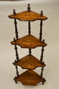 A four tier Edwardian inlaid what-not with turned supports. Est. £30 - £40.