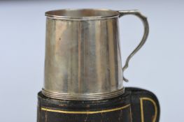 A small plain christening cup with reeded decoration in fitted case. London 1917. Approx. 125 grams.