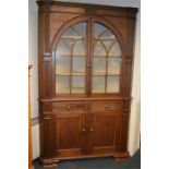 A large impressive corner cabinet with reeded stems, and oval doors. Est. £500 - £600.