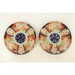 A pair of large circular Imari chargers. Est. £20 - £30.