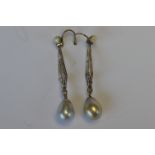 A pair of attractive pearl and diamond cocktail earrings, the body with pave set diamonds