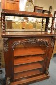 A mahogany chiffonier with moulded decoration and glazed door with barley twist supports. Est. £