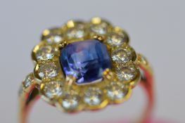 An attractive rectangular sapphire and diamond cluster ring with claw mount in 18ct setting. Est. £