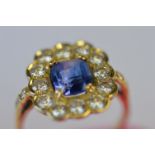 An attractive rectangular sapphire and diamond cluster ring with claw mount in 18ct setting. Est. £