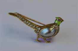 An attractive diamond brooch in the form of a pheasant with pearl body and enamelled head. Approx. 4