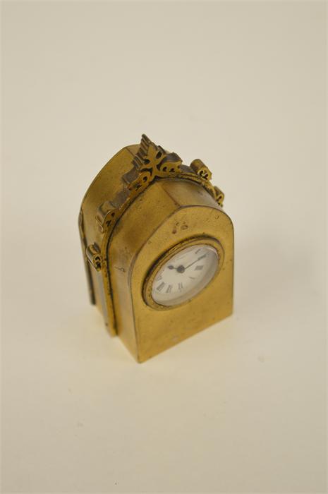 A miniature bedside clock in brass of Gothic design. By Benson. Est. £50 - £60. - Image 2 of 2