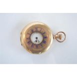 A gilt half hunter pocket watch with subsidiary seconds dial. Est. £30 - £40.