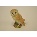 A Beswick figure of a barn owl. Est. £25 - £30.