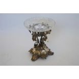 An attractive comport decorated with leaves, and flowers mounted with glass dish. Est. £280 - £320.