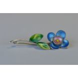 A silver enamelled flower brooch in the style of Bernard Instone. Est. £40 - £50.