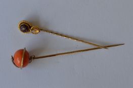 Two gold Antique snake mounted stick pins. Est. £30 - £40.