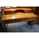 An attractive four drawer Edwardian mahogany desk with cross banded inlay. Est. £80 - £100.