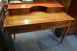 An attractive four drawer Edwardian mahogany desk with cross banded inlay. Est. £80 - £100.