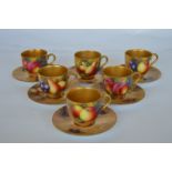 A group of six attractively painted Royal Worcester coffee cup and saucers with gilt bowls. Four