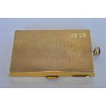 A good quality silver gilt engine turned cigarette box / photograph case, with loop top and hinged