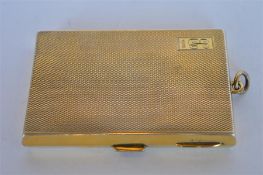 A good quality silver gilt engine turned cigarette box / photograph case, with loop top and hinged