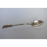 A heavy fiddle pattern basting spoon. London 1823. By WE & WF. Approx. 155 grams. Est. £80 - £100.