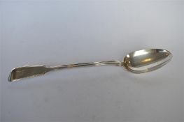 A heavy fiddle pattern basting spoon. London 1823. By WE & WF. Approx. 155 grams. Est. £80 - £100.