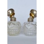 A good pair of hobnail cut scent bottles with engine turned decoration. London. By M&W. Est. £