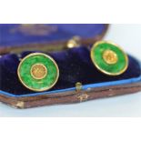 A pair of attractive boxed gold and jade cufflinks. Est. £400 - £450.