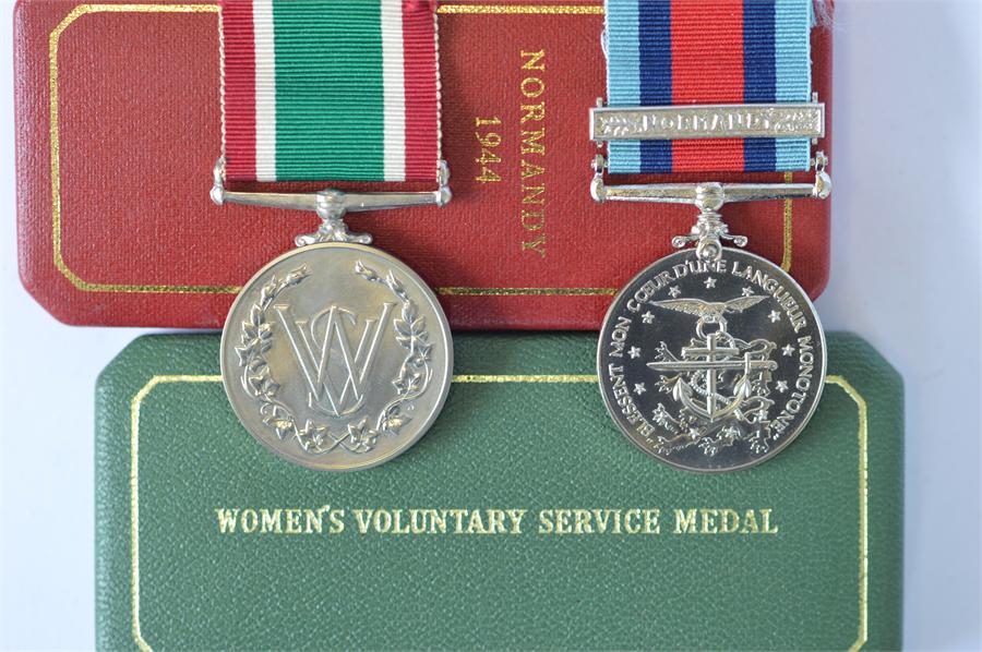 Cased WRVS Long service medal and Cased Normandy commemorative medal (numbered). Est. £20 - £30.