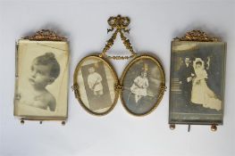 A pair of attractive brass mounted picture frames together with a swag decorated picture frame. Est.