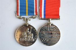 2x UK commemoratives; Cold War and National Service. Est. £15 - £20.