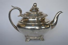A good Georgian helmet shaped teapot on scroll decorated feet with hinged lid. Newcastle 1820. By