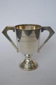An Art Deco style two handled trophy cup with tapered body. Birmingham 1931. By AEP. Approx. 300