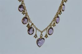 An attractive amethyst and pearl drop necklace with ring clasp. Est. £500 - £600.