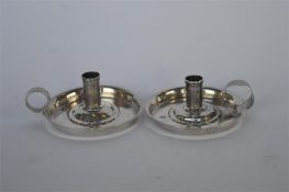 An unusual pair of George II miniature chamber sticks with plain thumb piece. Approx 5 cms across.
