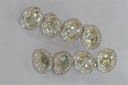 A good pair of important diamond and peridot ear pendants of oval form in 18ct white gold. Est. £900