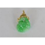 An attractive green jade pendant on loop top, mounted with diamonds. Est. £700 - £800.