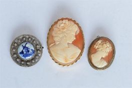 A 9ct oval framed cameo together with one other. Est. £15 - £20.