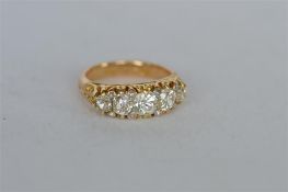 A good 18ct diamond half hoop ring in heavy 18ct carved setting. Est. £2600 - £3000.