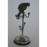 An attractive unusual ring stand in the form of a macaw on circular base. Birmingham 1912. By AL