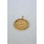 A 1898 Victorian half sovereign in gold surround. Est. £90 - £100.