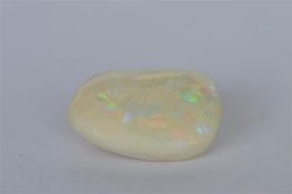 A large unmounted opal. Est. £30 - £40.