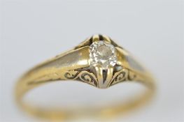 An 18ct diamond single stone gypsy set ring. Est. £60 - £70.