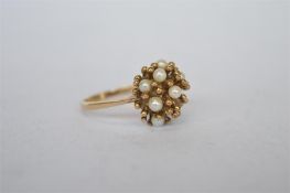 A 9 ct pearl cluster ring with ball decoration. Approx. 3 grams. Est. £30 - £35.
