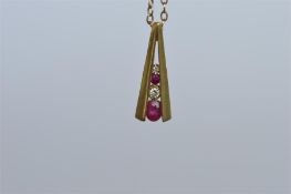 An attractive teardrop ruby and diamond pendant on fine link chain. Est. £30 - £40.